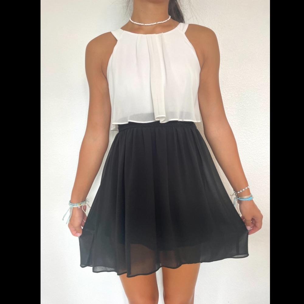 Formal black and white flowy dress with braided detail on waistline